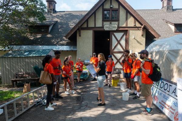 Executive Director of the Utica Zoo Andria De Lisle-Heath guides Utica College students through work at the Utica Zoo as part of Pioneer Pitch-In.